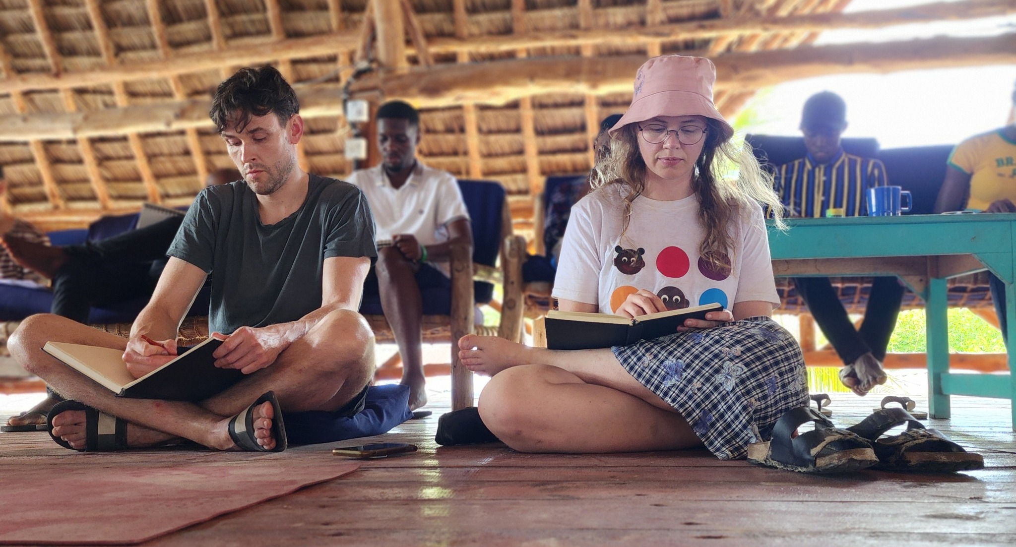 Participants collaborating around a laptop